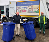 Inverclyde Council's blue recycling bins service is returning on Monday 15 June. Councillor Michael McCormick, Convener of Environment & Regeneration, with bin lorry driver James Dominick.